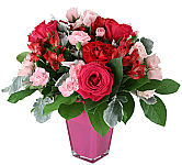 A trendy arrangement of blooms for the one who has your heart. Our classic Valentine’s arrangement is filled with rich reds and pinks to play up the romance. Hand-gathered inside a trendy pink vase to send all the right messages to that special someone.