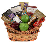 Tempting variety of assorted chocolates, chocolate bars, truffles and fresh fruit.