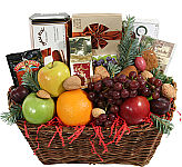 Fruit and Gourmet Christmas gift basket. Gourmet Fruit Basket of assorted fruit with added chocolates, cookies, nuts and a variety of snack and treat items with added seasonal trimmings.