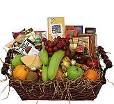 Christmas basket of assorted fresh fruit combined with snack and gourmet items, including cheese, crackers, bottled juice or water, cookies and much more. A great gift that will be enjoyed for days and days.