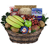 Assorted fresh fruit and gourmet basket with added sprigs of holly and Christmas greens.