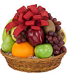 Classic Christmas basket of fresh, assorted fruit with colourful bow. Fruit includes apples, oranges, grapes, bananas and kiwi. Canada delivery next day.