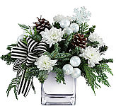 Make their dream of a white Christmas come true with this beautiful piece! White mums, ornaments, frosted pinecones and a black and white bow make this arrangement perfect for any holiday decor!