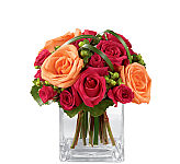 The FTD® Deep Emotions Rose Bouquet by Better Homes and Gardens features fuchsia roses, orange roses, fuscia spray roses, green hypericum berries and an artistic greenery treatment.
