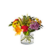 A touch of sherbert shades and textured beauty all in one standout bouquet. Filling our signature vase is a selection of lilies, snapdragons, gerbera daisies and more designed by an artisan florist. 