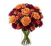 Beautiufl fall flower arrangement in red, orange, burgundy and peach colours available for delivery across Canada.