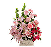 FTD's Beautiful Spirit Arrangement is a pretty display of pink roses, lilies and alstroemerias in a handled basket.