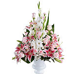 FTD's Precious Peace Arrangement is a beautiful funeral tribute of pink and white blooms in a traditional urn style.