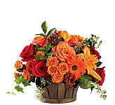 Woven basket arrangement of beautiful white and yellow flowers for birthdays or any occasion.