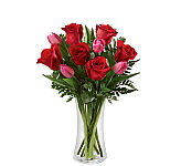 Give her a wonderful give that expresses your love and gratitude, featuring 9 or more long stemmed red roses expertly arranged with 6 or more pink tulips and lush greens.