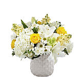 During times of sensitivity, share your thoughts and love with an arrangement that captures your sentiment. Our Comfort and Grace Bouquet is filled with a collection of white and yellow hydrangea blooms, lilies, stock, roses and more. Each bloom is elegantly complemented by a timeless grey basketweave patterned vase. 