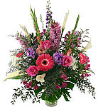 Large, colourful funeral arrangement made with assorted, premium floral varieties. Flower delivery across Canada with Canada Flowers.