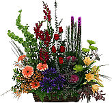 Sympathy window box funeral flower arrangement featuring an attractive display of groupings of fresh, colourful flowers in a wicker container. This is a very popular selection.