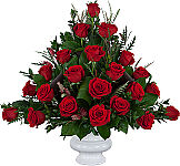 Impressive, highend arrangement of red roses with boxwood, grevillea and aspidistra.