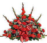 Traditional all red funeral arrangement, made with gladiolus, carnations and baby's breath. Expertly arranged and tied with a matching red bow. Canada delivery.