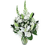 Condolence is a Canada Flowers Original sympathy floral gift suitable for the funeral home or the family residence during a time of loss. Same day delivery available.