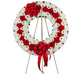 A traditional red and white funeral wreath for the funeral home, mortuary or church service. Available across Canada with Canada Flowers.