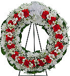 Traditional funeral wreath of red and white flowers with matching white bow. Available next day to most cities across Canada.