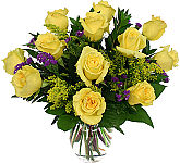 Spectacular arrangement of one dozen carefully selected yellow long stemmed roses, with added foliage, and special accents, including solidago and blue statice.