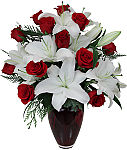 Send this luxury red vase arrangement when you need to send the very best. Trust canadaflowers.ca with your special Christmas flower deliveries.