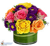 Glass bowl of assorted roses intermixed with pretty purple asters. Same day flower delivery across Canada with CanadaFlowers.CA.