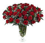 Choose from one to thirty six long stemmed red roses, florist arranged in a glass vase with greens and baby's breath, and hand delivered across Canada.