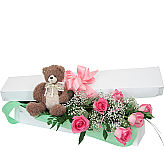 Boxed bouquet of six pink roses with baby's breeath and teddy bear. Same day delivery across Canada with Canada Flowers.