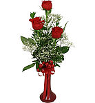 Delightful bud vase of 3 long stemmed red roses, arranged with baby's breath and foliage, tied with a red bow.