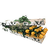 Dramatic wrapped bouquet of one dozen long stem yellow roses. Featuring reliable same day delivery across Canada. We are Canada Flowers, Canada's National Florist.