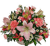Pink flowers arranged in a handled basket for sympathy. Flower delivery same day across Canada with Canada Flowers.