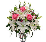 A Canada Flowers Original design of white lilies, lilsianthus and pink roses for sympathy. Same day flower delivery across Canada.
