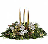 Teleflora's Royal Christmas Centerpiece. Place this item center stage for any royal Christmas gathering. Add to the pomp and circumstance of any festive galla with this elegant centerpiece of white and gold with ample seasonalgreens and trim.