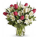 Includes pink tulips, white alstroemeria and variegated pittosporum. Delivered in a glass hurricane vase.