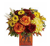 Teleflora's Autumn Expression floral arrangement by Canada Flowers, featuring orange roses with burgundy and yellow mums.