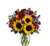 Pure Happiness is an arrangement of sunflowers, red roses, red miniature carnations, bronze chrysanthemums, monte cassino, bupleurum and more. Available for same day delivery across Canada.
