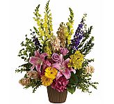 Teleflora's Glorious Grace Bouquet is a colourful funeral tribute in a traditional urn, available same day across Canada.