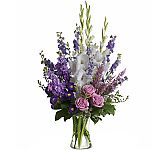 Teleflora's Joyful Memory is a beautiful vased flower arrangement in white, lavender, pink and purple. A fitting tribute indeed.