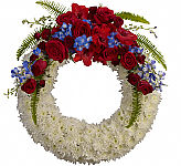 A beautiful white funeral wreath with a soaring red and blue spray is a beautiful tribute at a time of loss. Delivery across Canada.