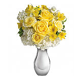 A pretty arrangement of yellow roses, white hydrangea, yellow alstroemeria and white stock. Same day delivery across Canada.