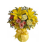 Vase arrangement of yellow lilies with peach and white roses and yellow alstroemerias. Sunny flowers for Mother's Day by Canada Flowers.