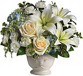 Teleflora's Beautiful Dreams sympathy flowers for delivery across Canada. White lilies, creme roses, blue hydrangea and more are arranged to express sympathy.