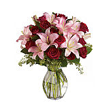 Teleflora's Lavish Love red roses and pink Asiatic lily bouquet, featuring delivery to most towns and cities across Canada with Canada Flowers, Canada's National Florist.
